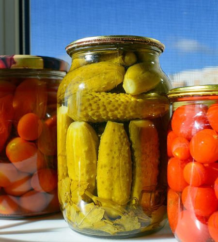 Canva---Pickled-Cucumbers-and-Tomatoes-in-Glass-Jars